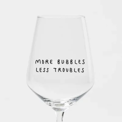 "More Bubbles, Less Troubles" | Weinglas